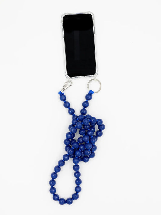 A blue beaded phone strap with a silver clasp and key ring, shown attached to a smartphone on a plain white background.
