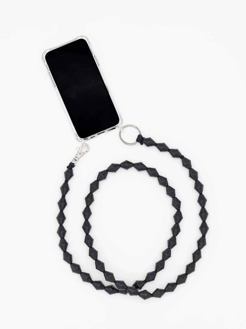 A geometric black beaded phone strap with a silver clasp and key ring, shown attached to a smartphone on a plain white background.