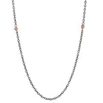 Necklace with small round beads on a thin chain