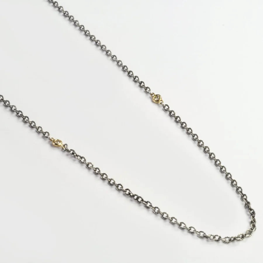 Silver chain necklace on a white background