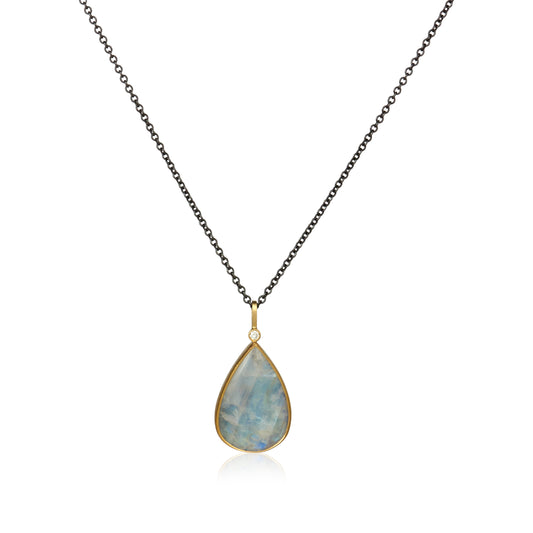 Moonstone pendant set in 18k gold on an oxidized sterling silver chain