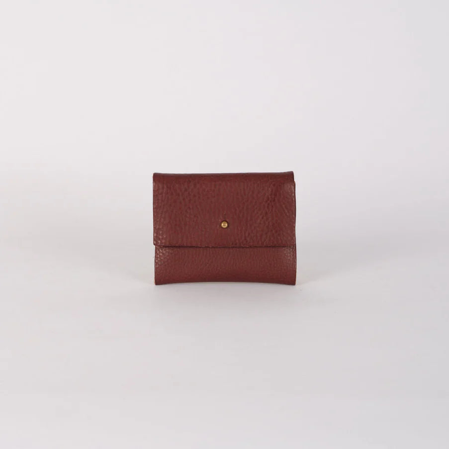Brown leather wallet on a light gray background