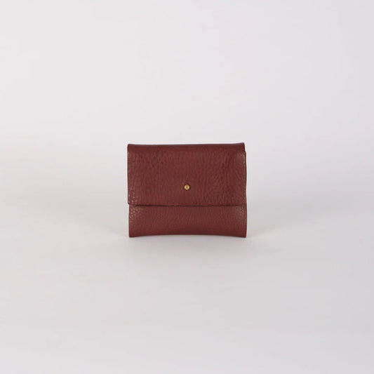 Brown leather wallet on a light gray background