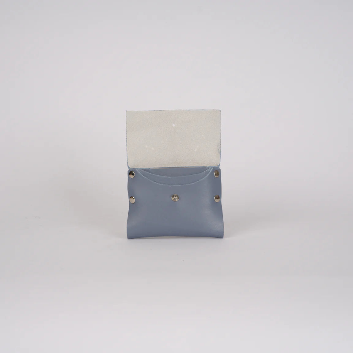 Two-tone leather pouch with gray top and blue bottom on a light gray background
