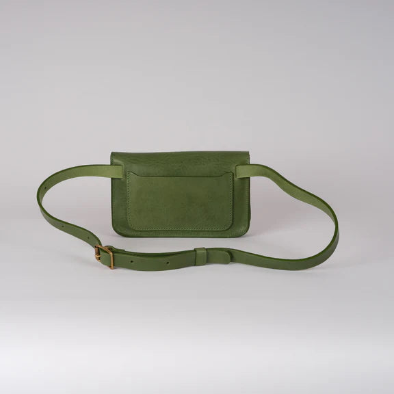 Picture of green handbag on grey background.  Rear view.
