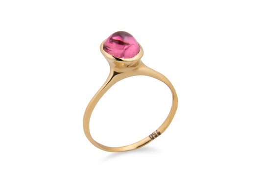 gold ring with single pink tourmaline gemstone