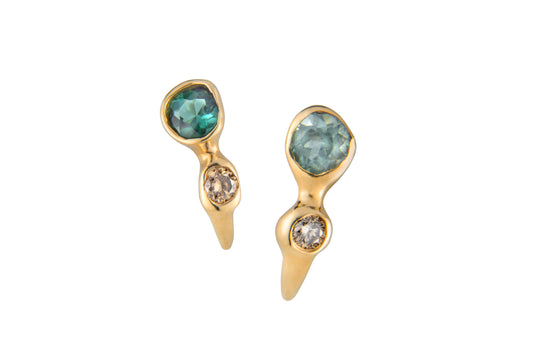 Gold post earrings with blue tourmalines and cognac diamonds