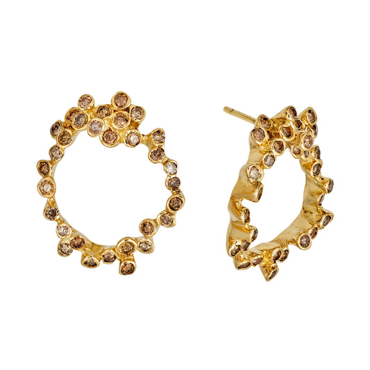 Gold post earrings with white and cognac diamonds in organic style