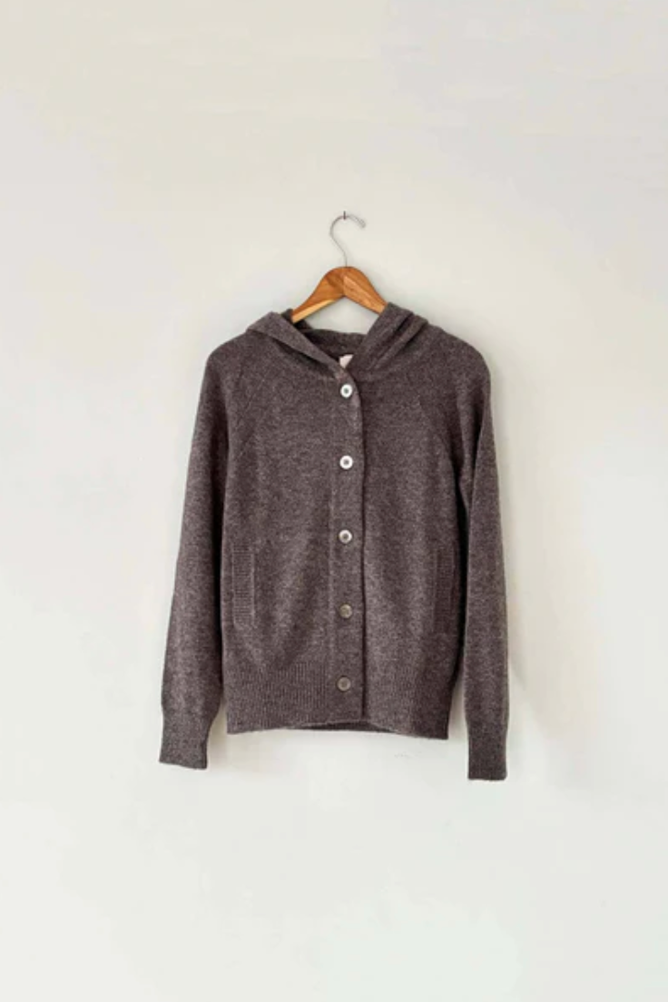 A brown button up hoodie sweater on a wooden coat hanger. 