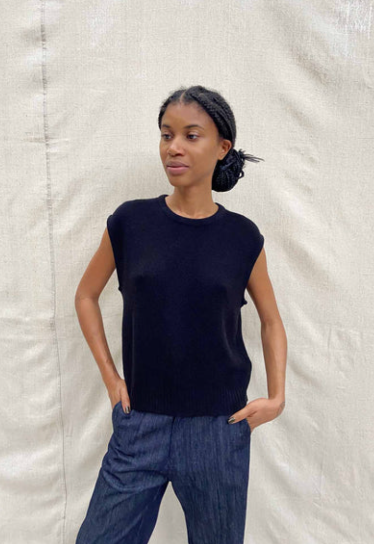 Sleeveless cashmere bleck shell. crew neck, worn with blue jeans