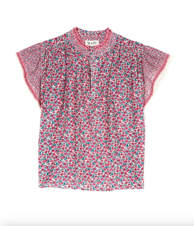 mini floral print flutter sleeve top. Slit neckline with one button at the top. Relaxed fit