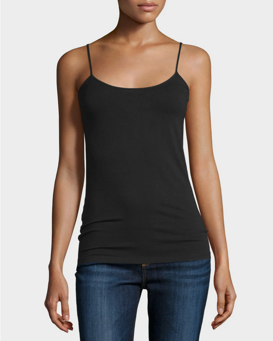 Black spaghetti strap top worn by a person on a white background