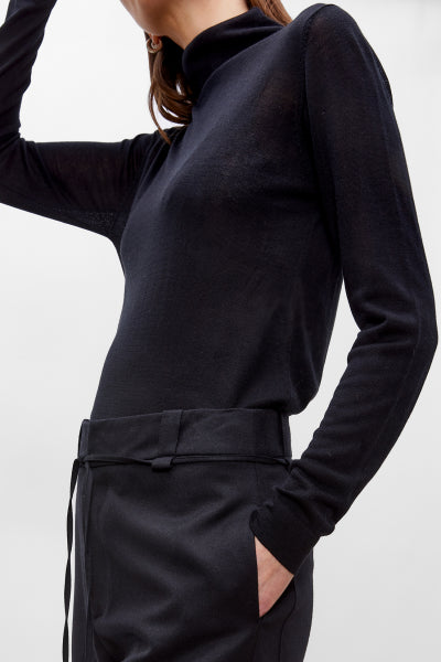 Black long-sleeve top and pants on a white background