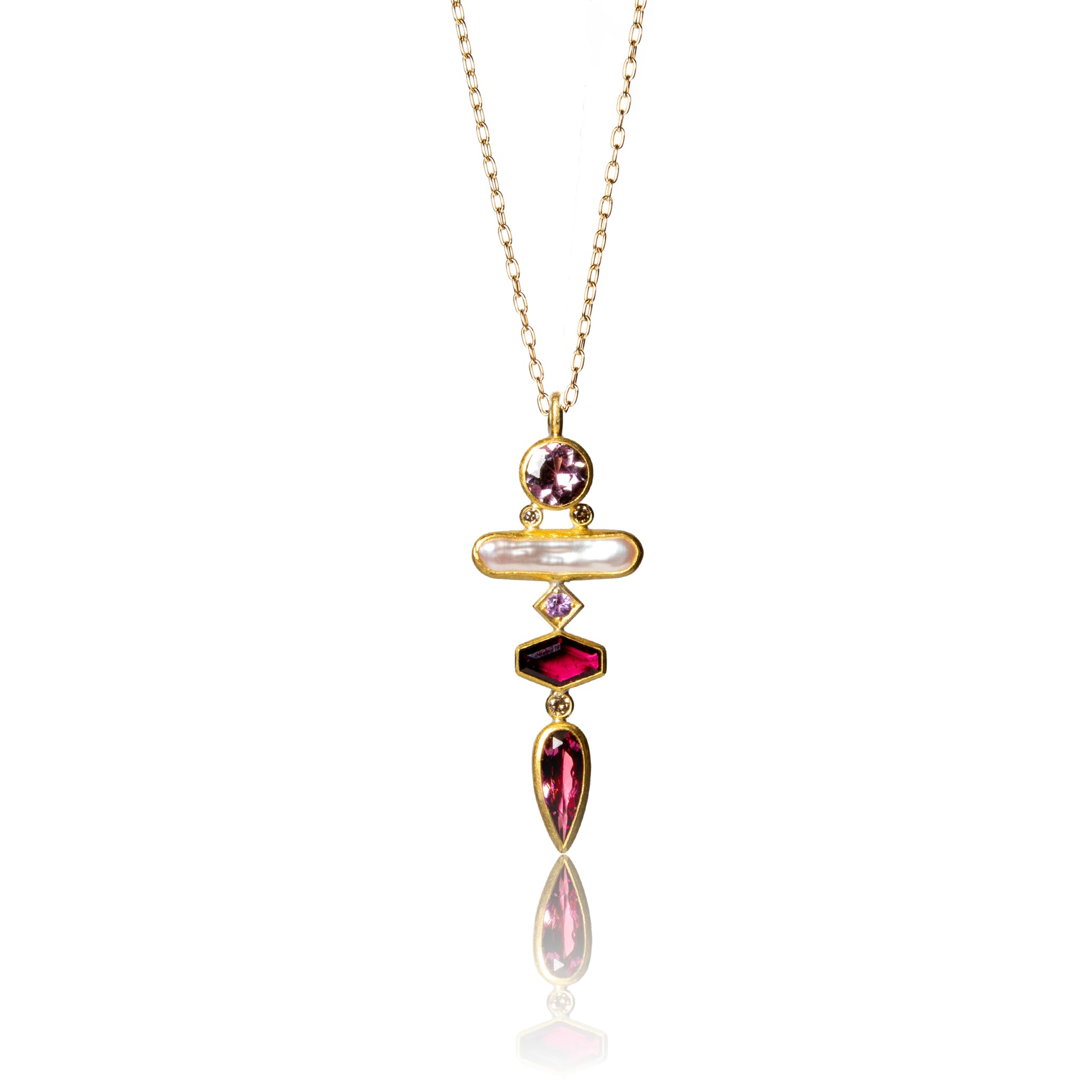 Pendant with white pearl and pink hued gemstones set in gold.