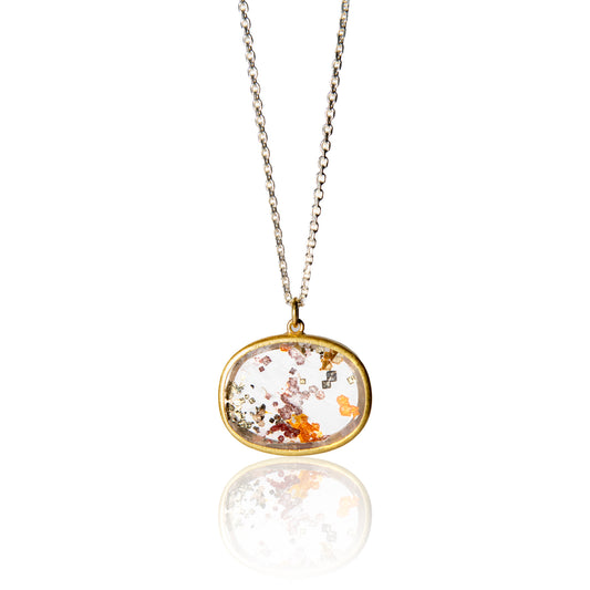 oval quartz with pyrite inclusions pendant with gold setting and silver chain