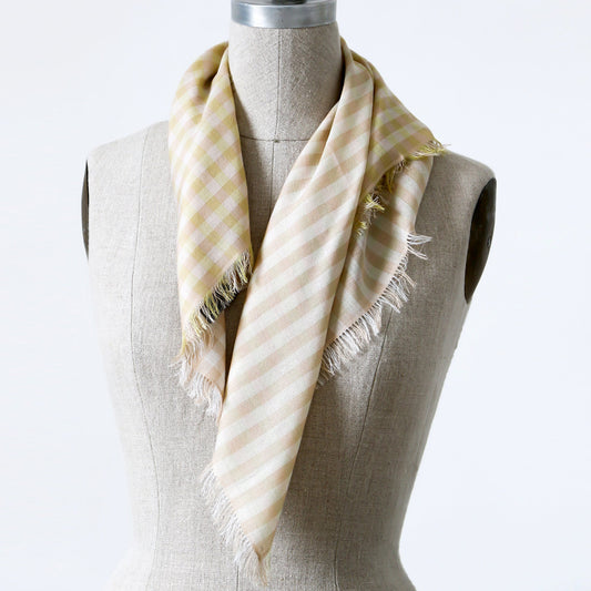 A small beige, white, and chartreuse checkered gingham scarf shown wrapped around a mannequin.