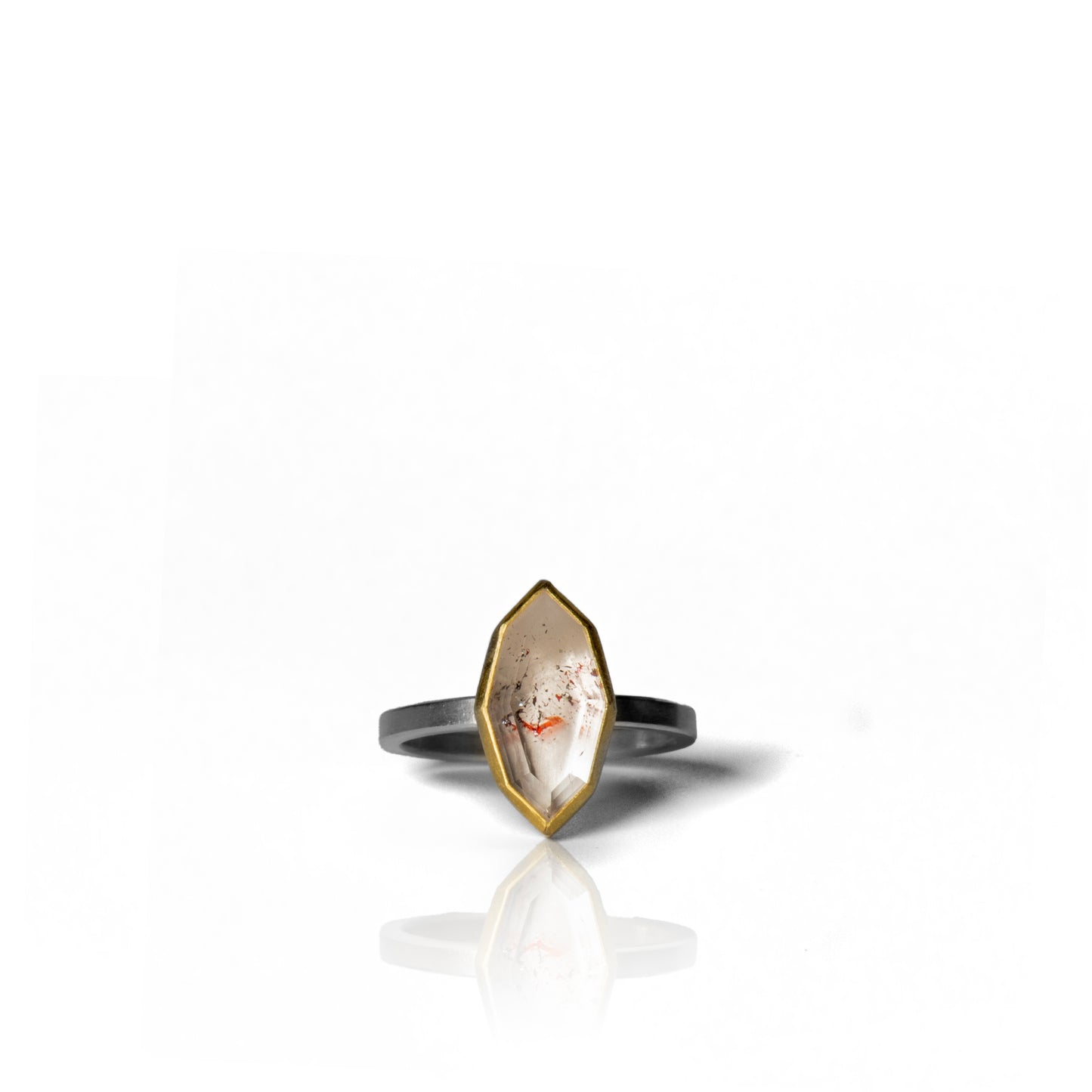 Marquise shaped fire quartz ring with gold bezel and silver band