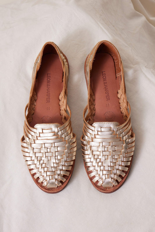 photo of gold leather woven sandals