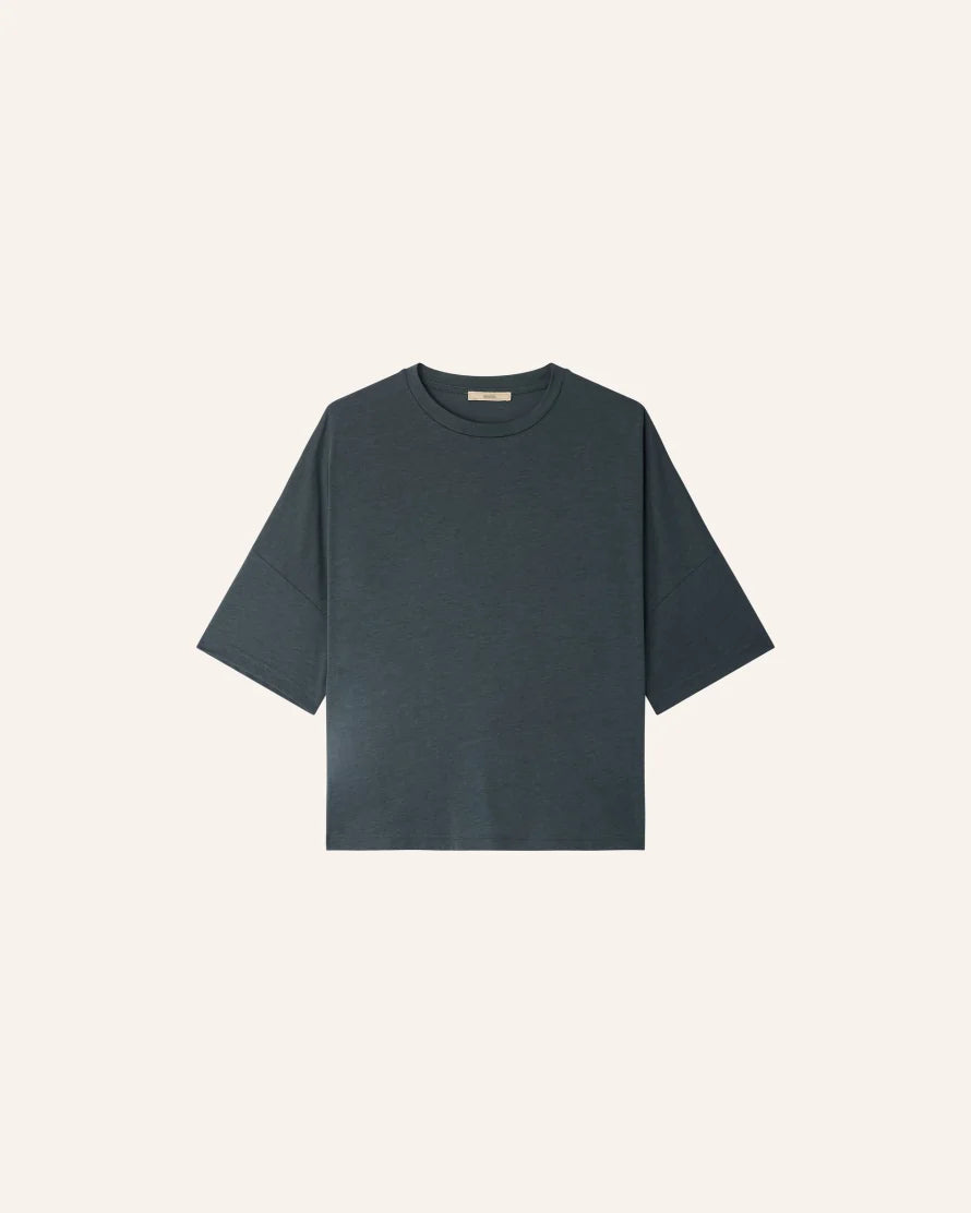 Oversized green T-shirt on a white background