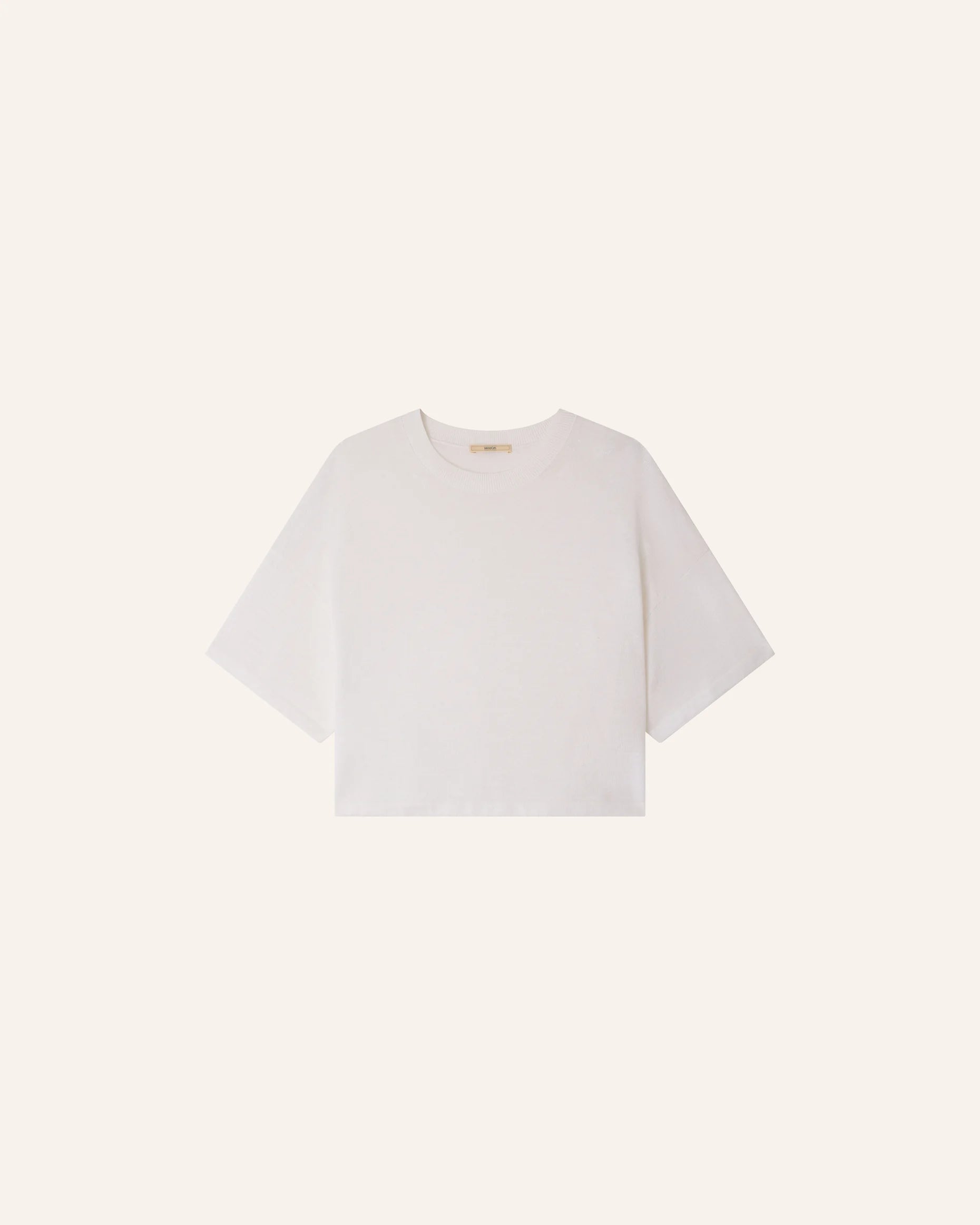 White t-shirt on a light beige background