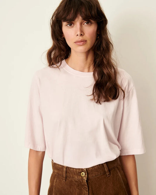Model wearing a Rose T-shirt with elbow length sleeves. White background