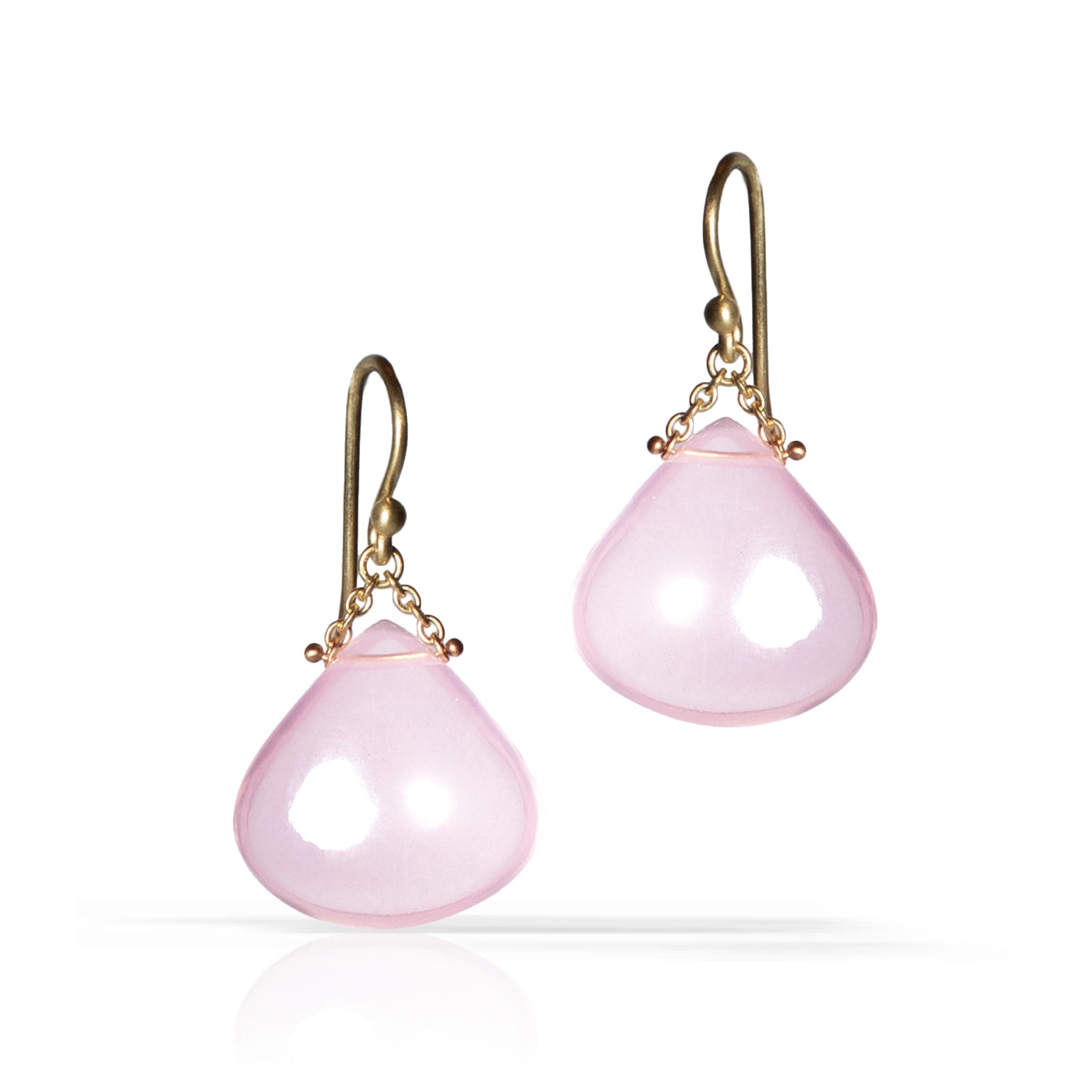 A pair of teardrop-shaped pink stone dangle earrings with antique gold hooks and chain details, shown on a clean white background with a soft reflection.