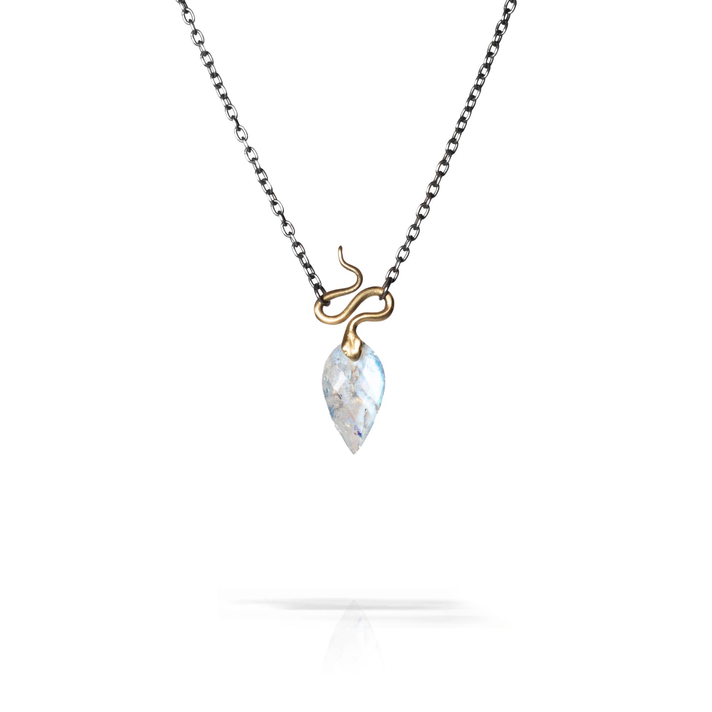A delicate necklace featuring a small gold snake wrapping around a teardrop-shaped white marbled gemstone pendant, suspended from a dark silver chain on a white background.