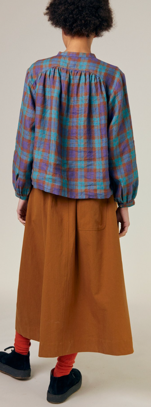 Back view, gathers along yoke seam, full sleeve shape