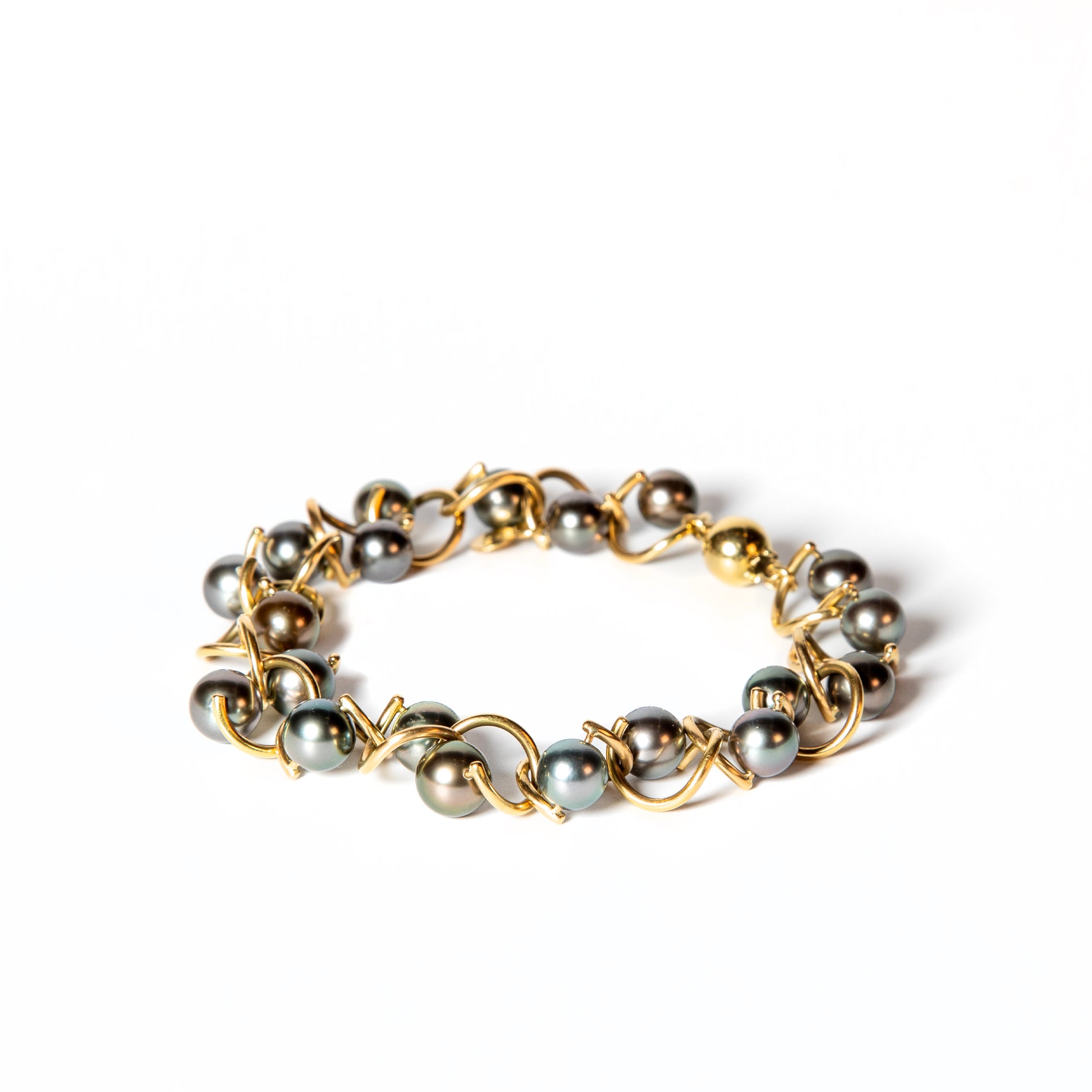 Green pearls and gold twist series bracelet by Sofie Lunoe pictured closed