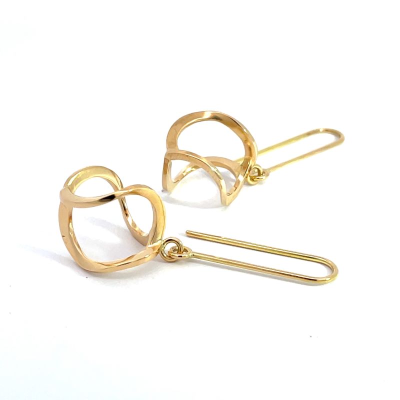 A pair of yellow gold earrings with a helix twist.