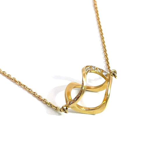 A gold necklace with a helix pendant, accented with small diamondws along the top curve, shown on a white background.