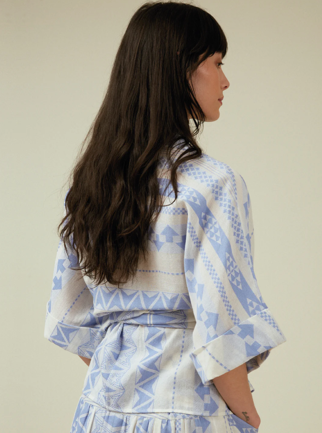 Woman weqaring Gloria blouse in blue and white by Tallulah & Hope.