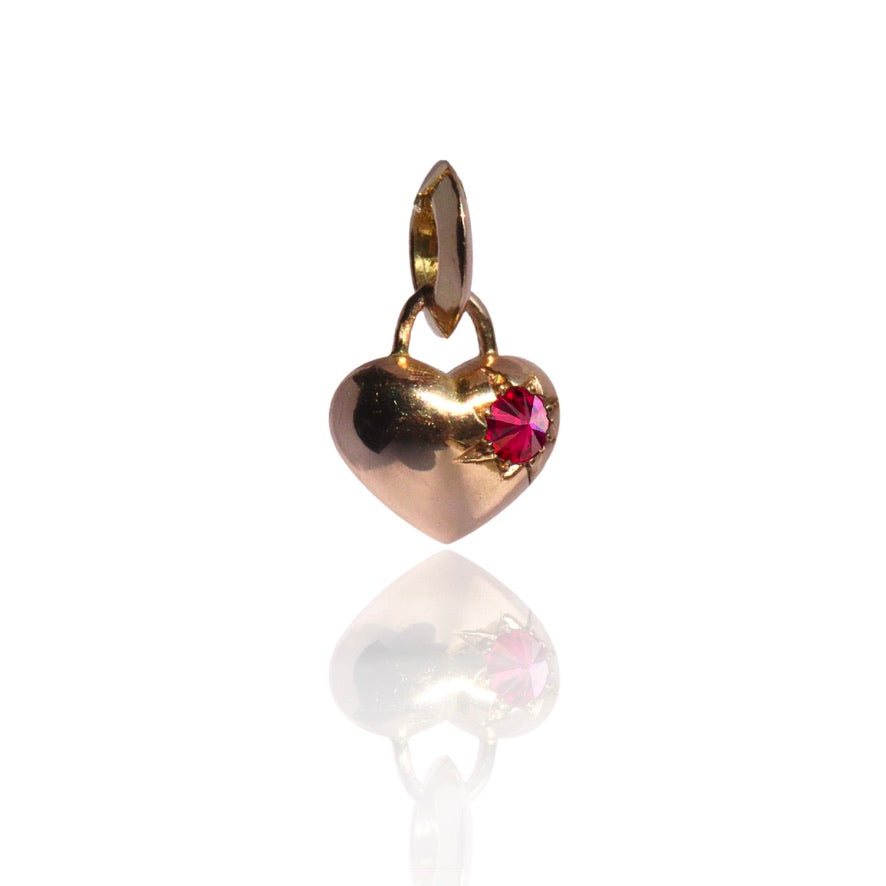 Gold heart charm with single ruby