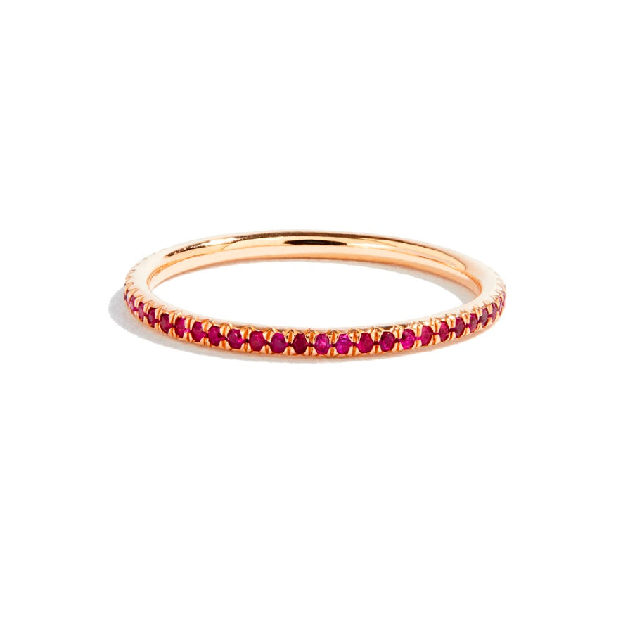 Rose gold eternity ring with rubies