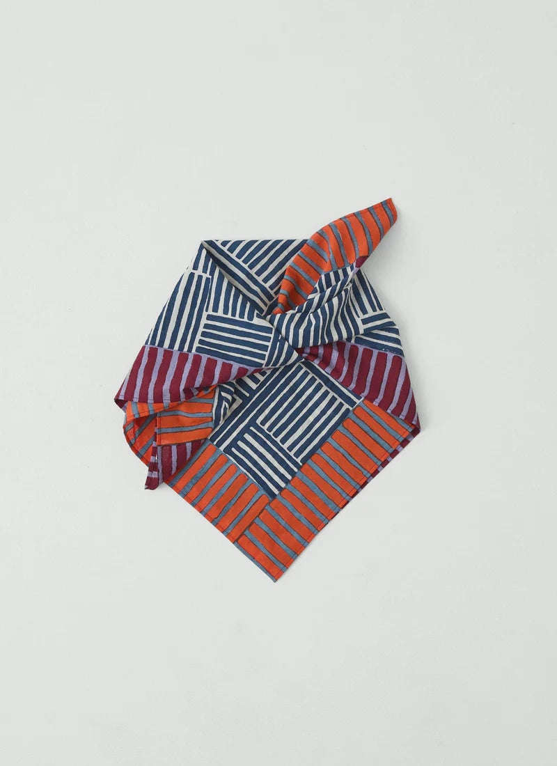 Folded block print bandana on white background