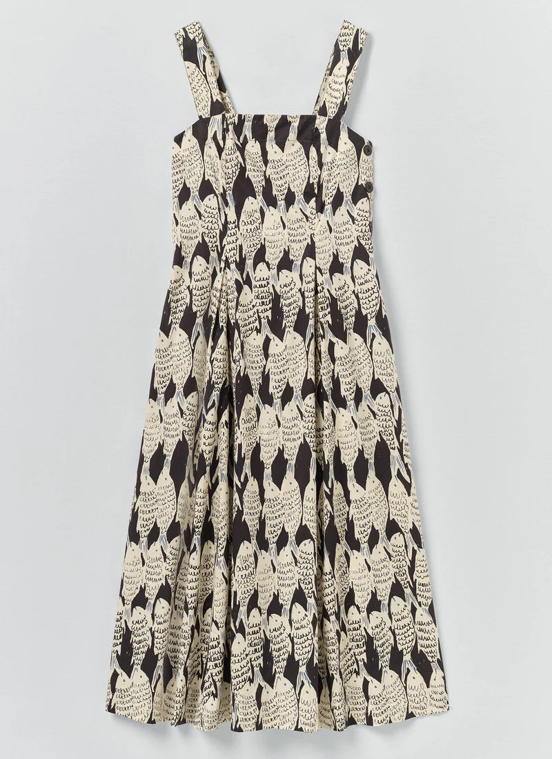 a sleeveless dress with a fish pattern on a plain background