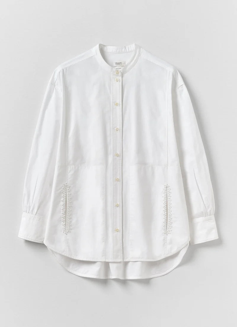 A long-sleeve white shirt against a white background.