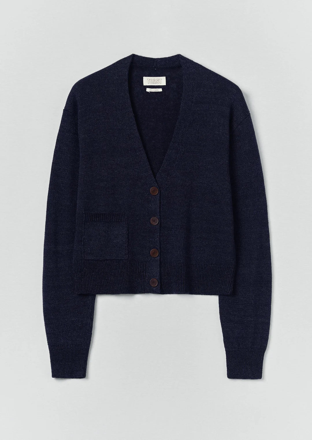 Navy blue cardigan on a light gray background