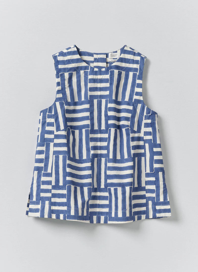 Blue and white patterned top on a light gray background