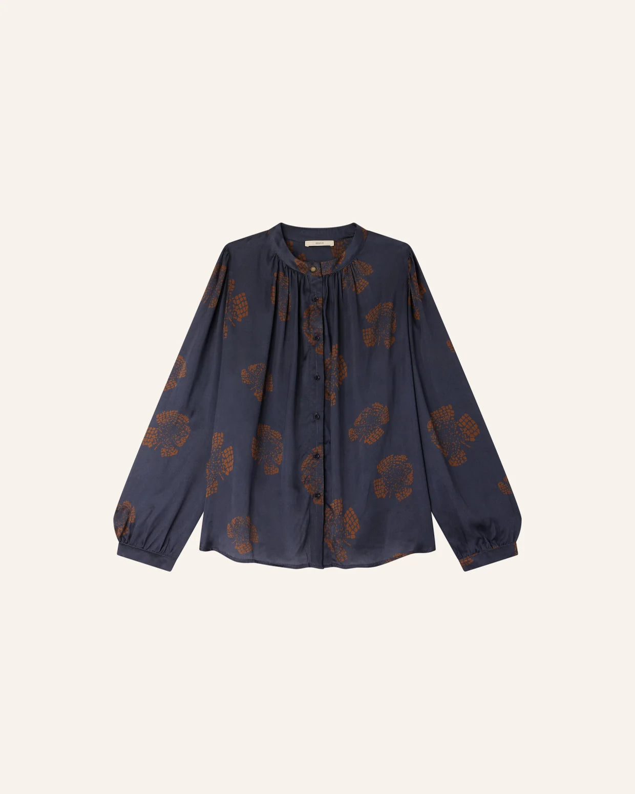 Navy blue blouse with brown floral patterns on a white background