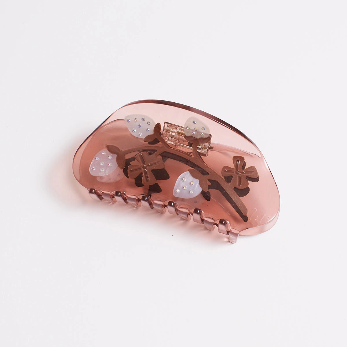 A translucent dusty rose hair claw clip decorated with white pineberries embellishes with sparkling seeds, shown on a clean white background.