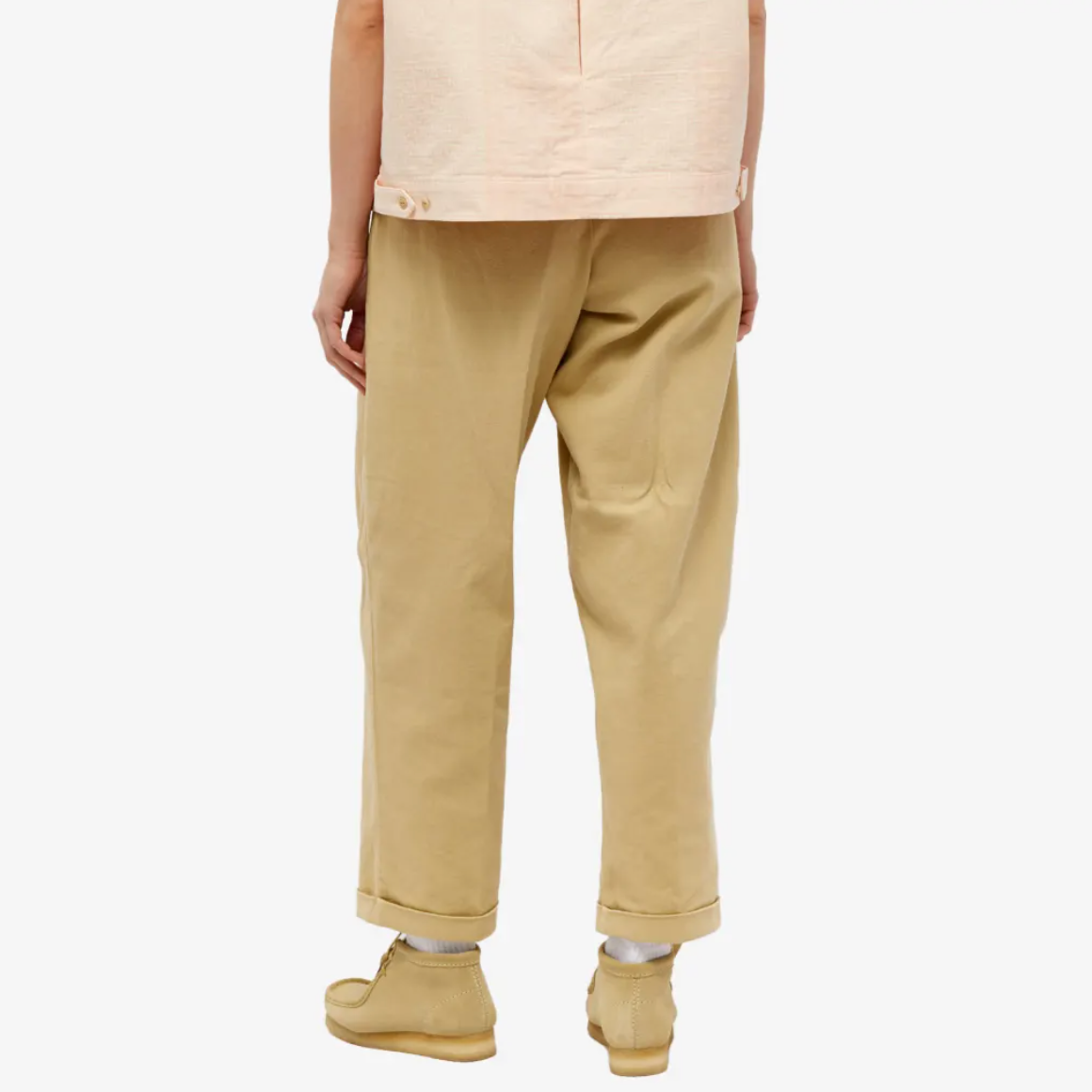 rear view of person wearing baggy sand colored pants