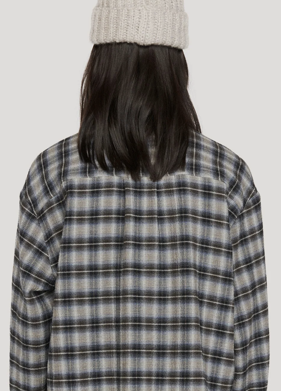 Back view of long sleeve black blue check shirt