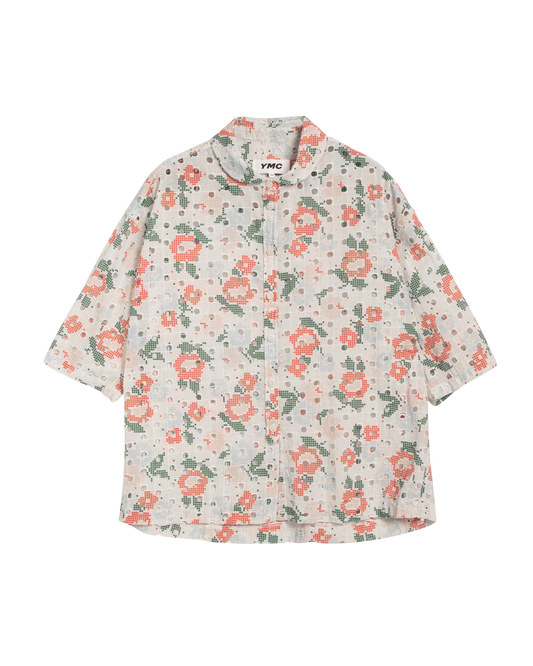 Front view of woman's short sleeve shirt with oink flowers and green leaves motif