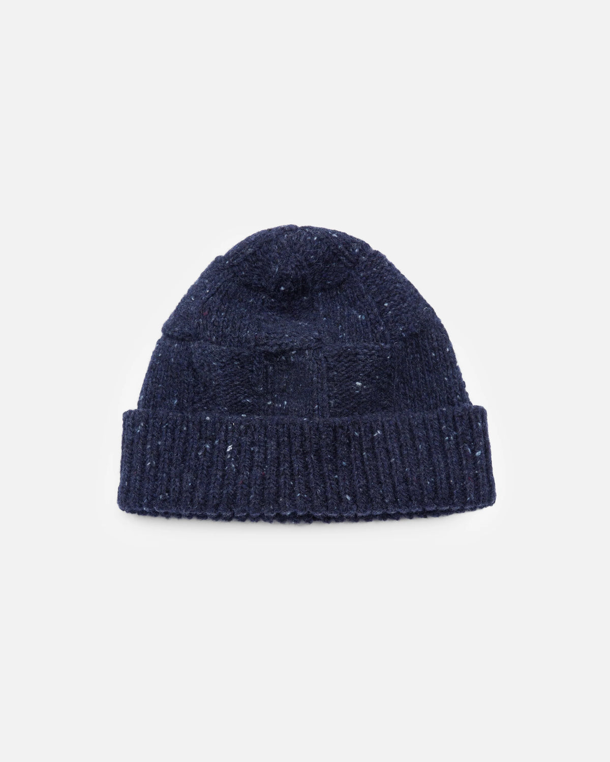 A dark navy blue knit beanie hat with subtle white speckles, shown flat against a light gray background.