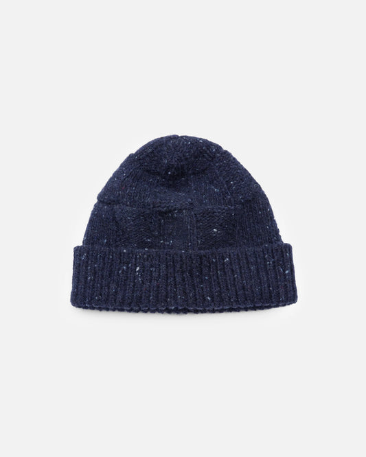 A dark navy blue knit beanie hat with subtle white speckles, shown flat against a light gray background.