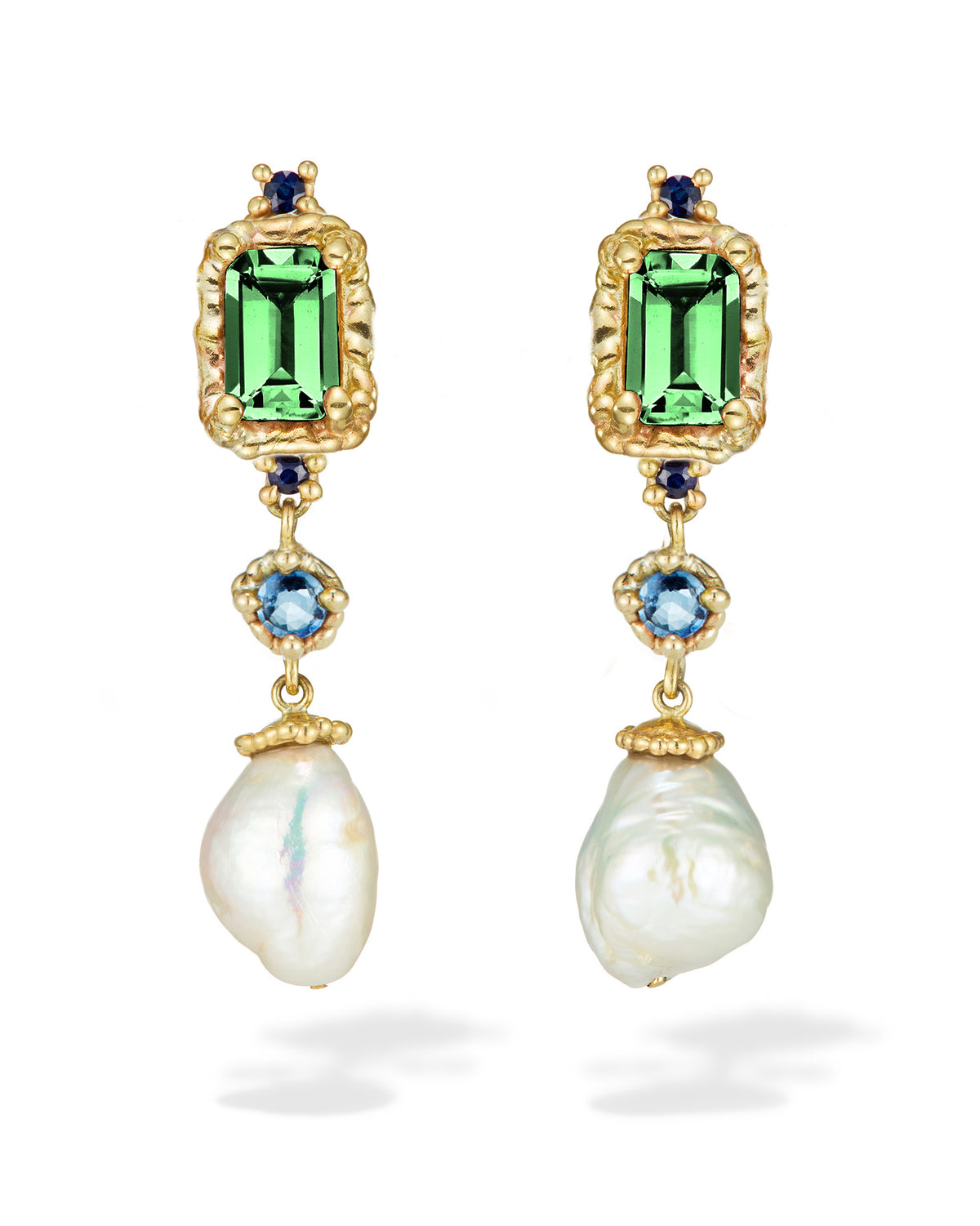A pair of yellow gold earrings with green tourmalines, blue sapphires, and freshwater pearls in a vertical stack.