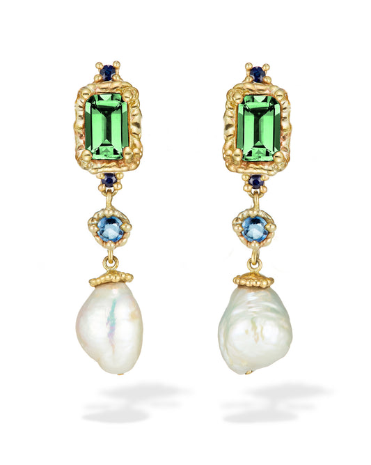 A pair of yellow gold earrings with green tourmalines, blue sapphires, and freshwater pearls in a vertical stack.