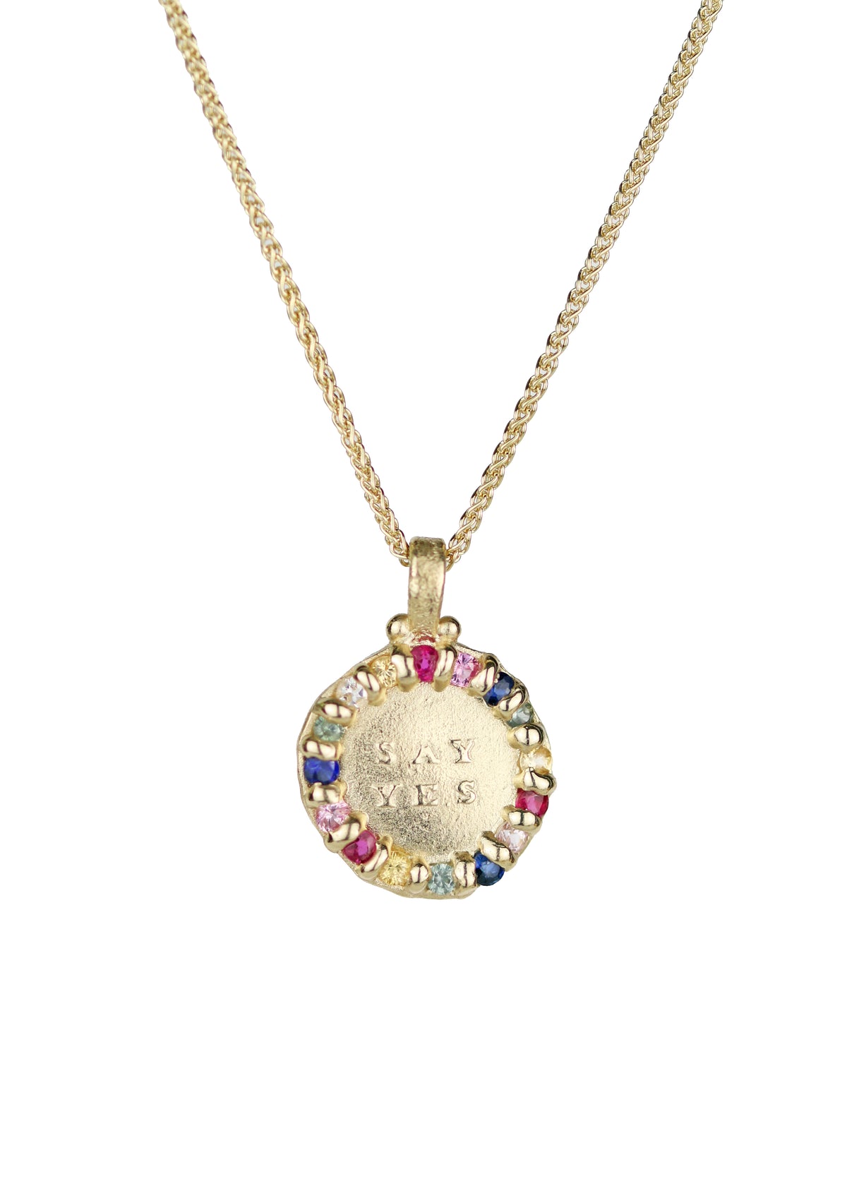 A yellow gold necklace with a pendant with a messaging saying 'SAY YES', surrounded by colored sapphires.