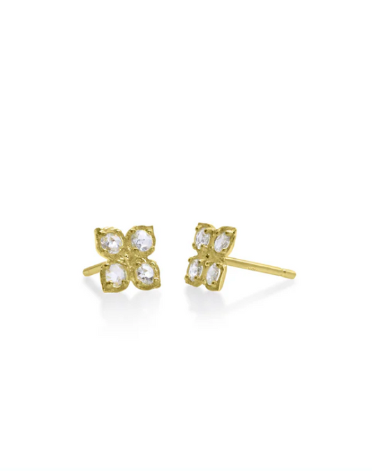 Tiny gold flower shaped stud earrings with diamonds